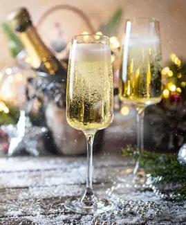two glasses of champagne sitting next to each other