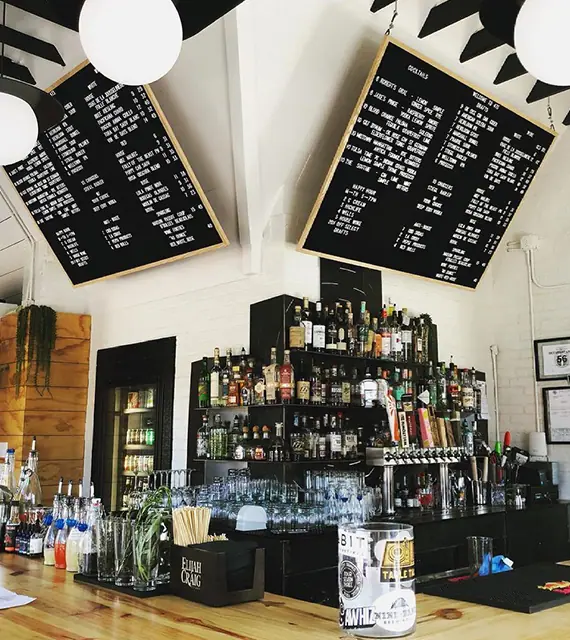 a bar with lots of bottles and drinks on it